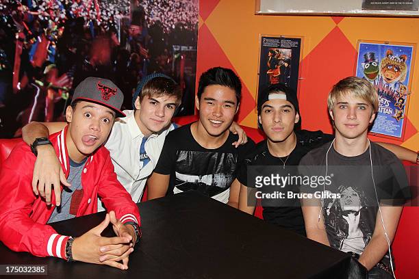 Dana Vaughns, Cole Pendery, Will Jay, Gabe Morales and Dalton Rapattoni of the group IM5 visit Planet Hollywood Times Square on July 29, 2013 in New...