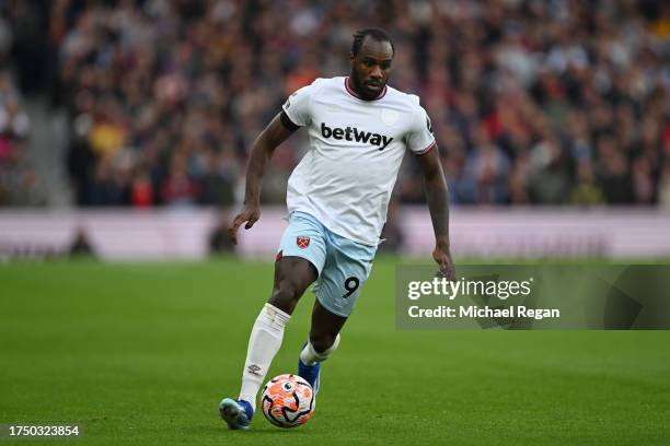 Michail Antonio of West Ham United runs with the ball during the Premier League match between Aston Villa and West Ham United at Villa Park on...