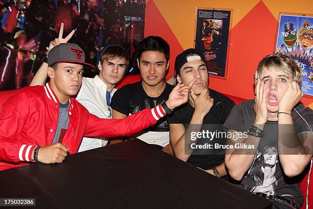 Dana Vaughns, Cole Pendery, Will Jay, Gabe Morales and Dalton Rapattoni of the group IM5 visit Planet Hollywood Times Square on July 29, 2013 in New...