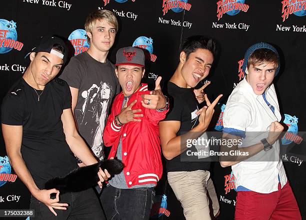 Gabe Morales, Dalton Rapattoni, Dana Vaughns, Cole Pendery and Will Jay of the group IM5 visit Planet Hollywood Times Square on July 29, 2013 in New...