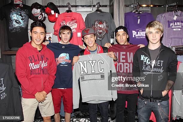 Will Jay, Cole Pendery, Dana Vaughns, Gabe Morales and Dalton Rapattoni of the group IM5 visit Planet Hollywood Times Square on July 29, 2013 in New...