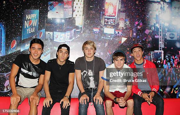 Will Jay, Gabe Morales, Dalton Rapattoni, Cole Pendery and Dana Vaughns of the group IM5 visit Planet Hollywood Times Square on July 29, 2013 in New...