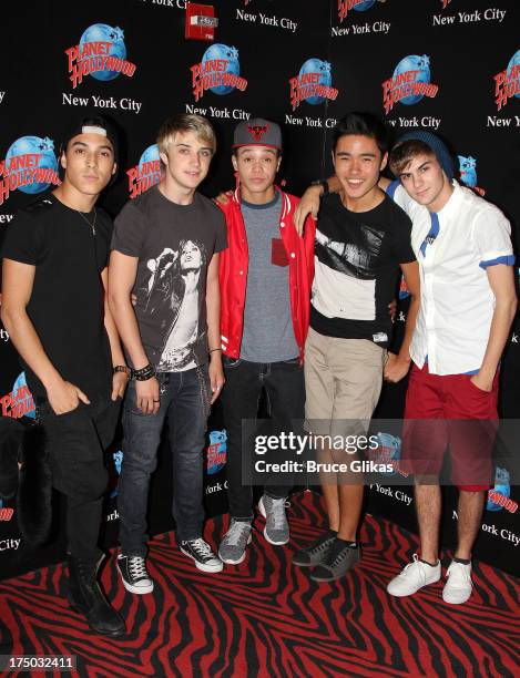 Gabe Morales, Dalton Rapattoni, Dana Vaughns, Cole Pendery and Will Jay of the group IM5 visit Planet Hollywood Times Square on July 29, 2013 in New...