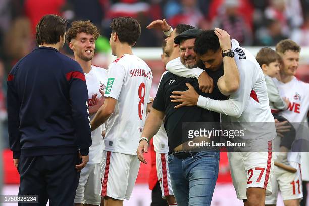 Steffen Baumgart, Head Coach of 1.FC Köln, and Davie Selke of 1.FC Köln embrace as they celebrate victory at full-time following the Bundesliga match...