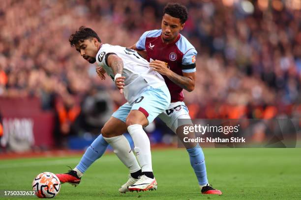 Lucas Paqueta of West Ham United battles for possession with Boubacar Kamara of Aston Villa during the Premier League match between Aston Villa and...