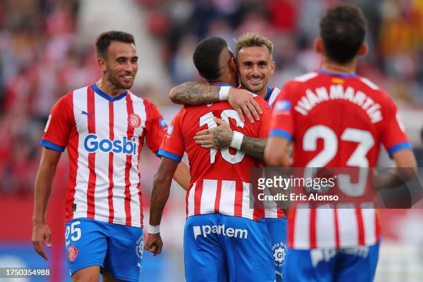 Savio of Girona FC celebrates with team mates after scoring the team's fourth goal during the LaLiga EA Sports match between Girona FC and UD Almeria...