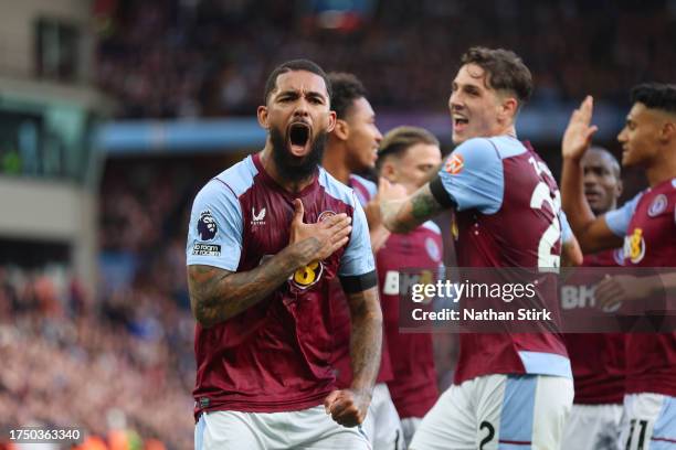 Douglas Luiz of Aston Villa celebrates after scoring the team's first goal during the Premier League match between Aston Villa and West Ham United at...