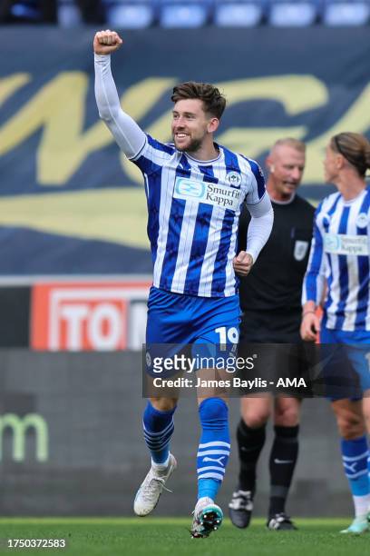 Callum Lang of Wigan Athletic celebrates after scoring a goal to make it 2-0 during the Sky Bet League One match between Wigan Athletic and...