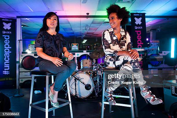 Miss Info and Solange talk after her performance at the "vitaminwater and The Fader present uncapped" at the Atlantis Laundromat on July 29, 2013 in...