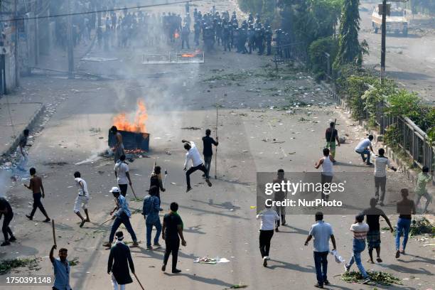 Bangladesh Nationalist Party activists' light fires during a rally demanding the resignation of Prime Minister Sheikh Hasina and the release of BNP...