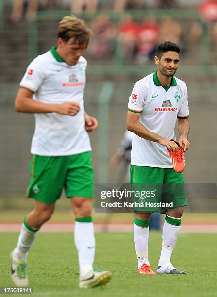 Mehmet Ekici of Werder Bremen with his shoe during the friendly match between RW Erfurt and SV Werder Bremen at Steigerwaldstadion on July 25, 2013...