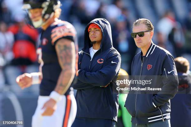 Justin Fields of the Chicago Bears and Chicago Bears head coach Matt Eberflus watch warm ups before the game against the Las Vegas Raiders at Soldier...