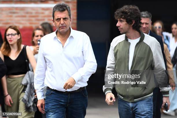 Presidential candidate for Union Por La Patria Sergio Massa talks to Mayor of San Fernando Juan Andreotti after casting his vote during the general...