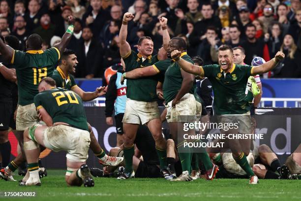 South Africa's fly-half Handre Pollard celebrates with teammates after South Africa won the France 2023 Rugby World Cup Final match between New...