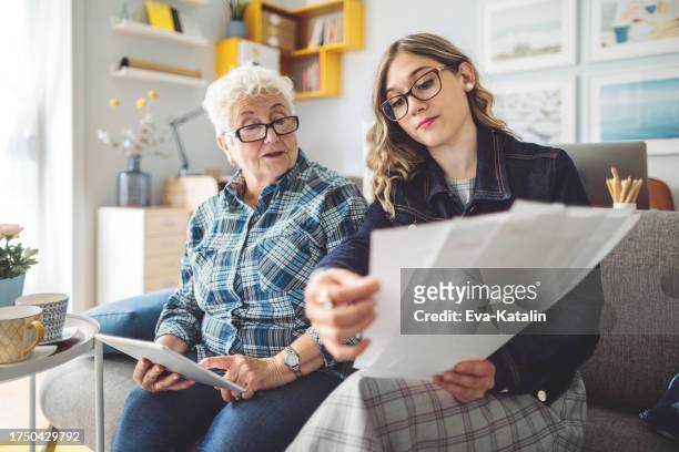 senior woman at home - grandma invoice bildbanksfoton och bilder