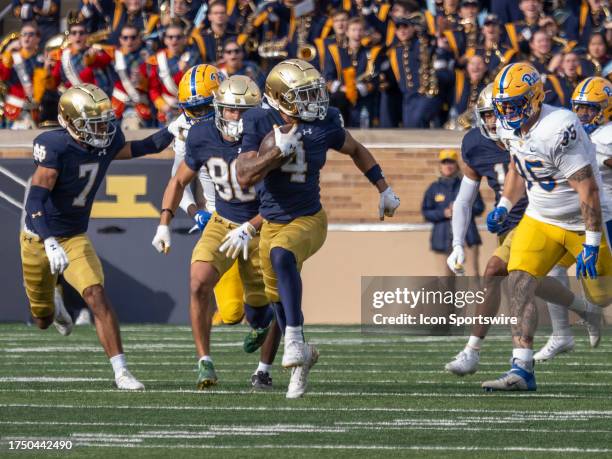 Notre Dame Fighting Irish wide receiver Chris Tyree returns a punt for a 82 yard touchdown during the college football game between the Pittsburgh...