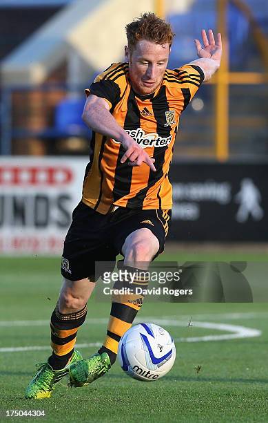 Stephen Quinn of Hull City runs with the ball during the pre season friendly match between Peterborough United and Hull City at London Road Stadium...