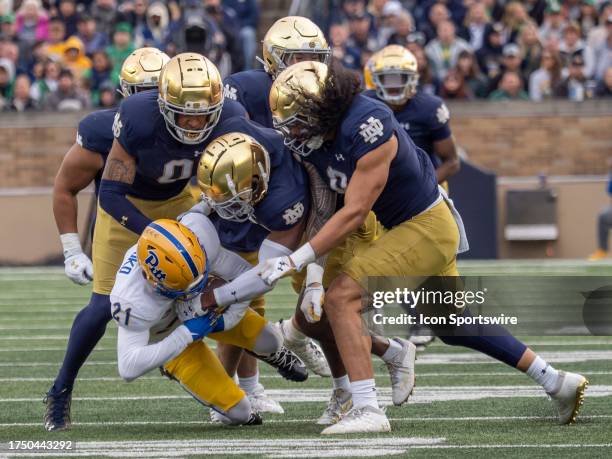 Pittsburgh Panthers wide receiver Che Nwabuko gets tackled by the Notre Dame Fighting Irish defensive line during the college football game between...