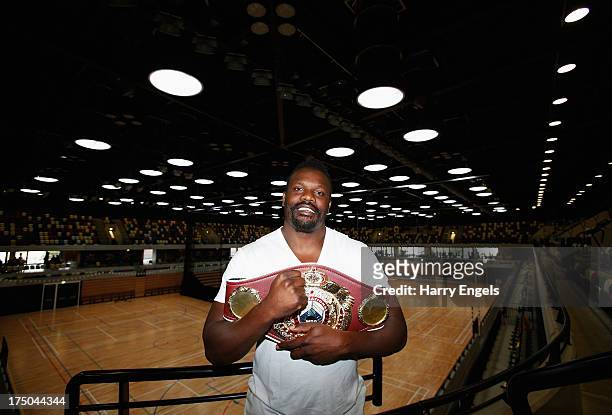 Dereck Chisora poses with his WBO International Heavyweight Championship belt prior to a press conference organised by boxing promoter Frank Warren...