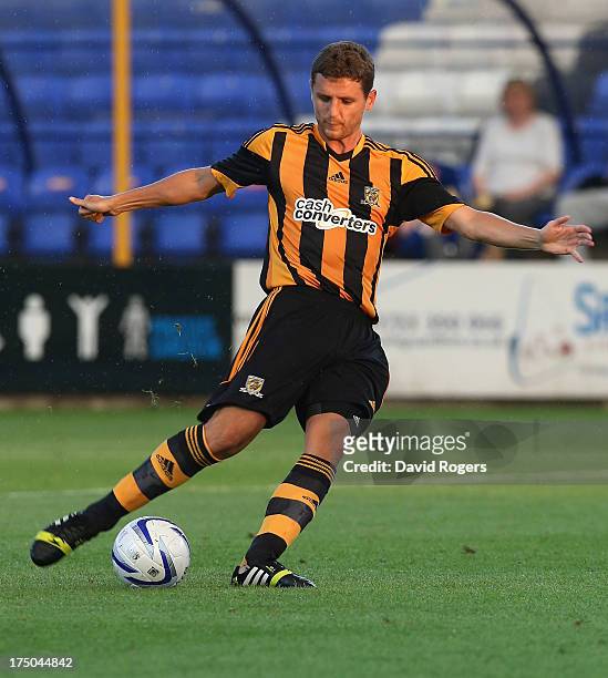 Alex Bruce of Hull City passes the ball during the pre season friendly match between Peterborough United and Hull City at London Road Stadium on July...