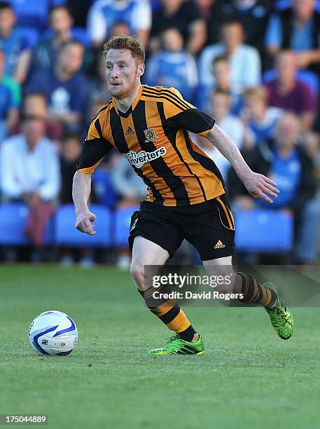 Stephen Quinn of Hull City runs with the ball during the pre season friendly match between Peterborough United and Hull City at London Road Stadium...