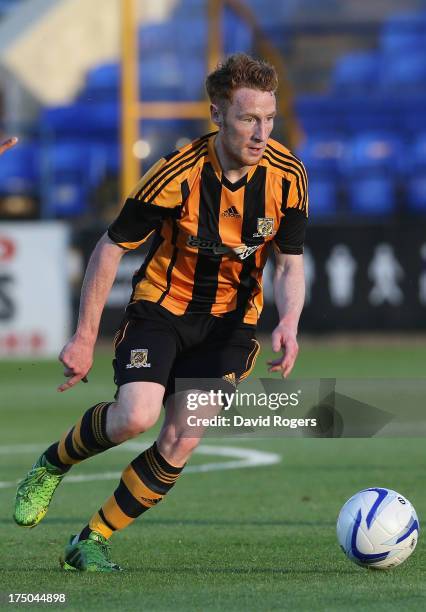 Stephen Quinn of Hull City runs with the ball during the pre season friendly match between Peterborough United and Hull City at London Road Stadium...