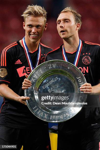 Viktor Fischer and Christian Eriksen of Ajax pose with the trophy after victory in the Johan Cruyff Shield match between AZ Alkmaar and Ajax...