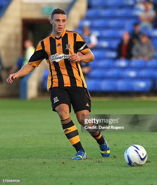 James Chester of Hull City passes the ball during the pre season friendly match between Peterborough United and Hull City at London Road Stadium on...