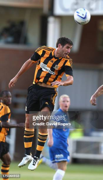 Danny Graham of Hull City heads the ball during the pre season friendly match between Peterborough United and Hull City at London Road Stadium on...