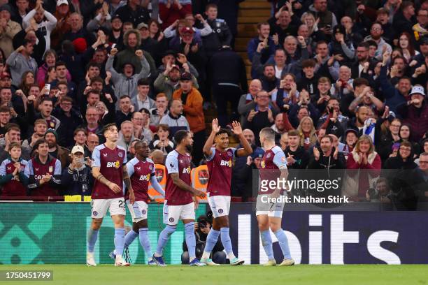 Ollie Watkins of Aston Villa celebrates with team mates after scoring the team's third goal during the Premier League match between Aston Villa and...