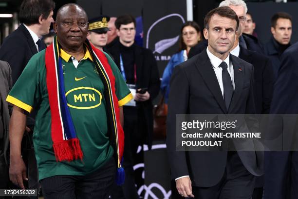 President of South Africa Cyril Ramaphosa and French President Emmanuel Macron are make their way to the field after South Africa won the France 2023...
