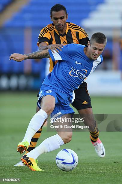 Danny Kearns of Peterborough United controls the ball during the pre season friendly match between Peterborough United and Hull City at London Road...