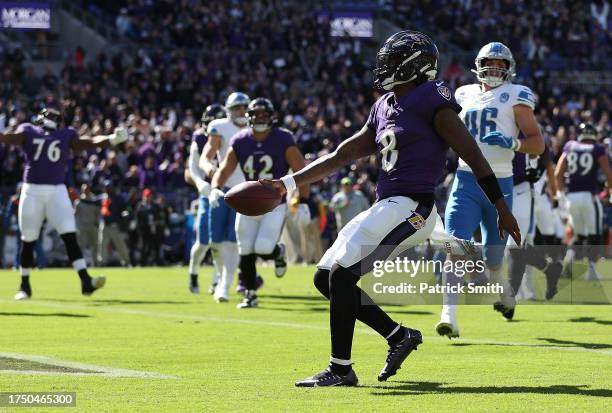 Lamar Jackson of the Baltimore Ravens scores a rushing touchdown in the first quarter of the game against the Detroit Lions at M&T Bank Stadium on...
