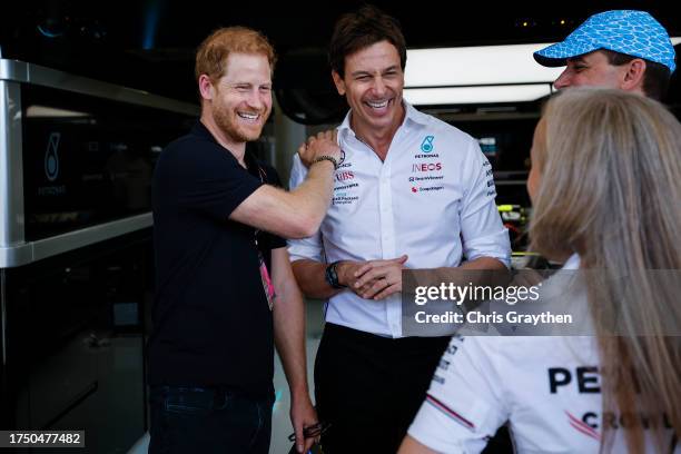 Prince Harry, Duke of Sussex speaks to Mercedes GP Executive Director Toto Wolff in the garage prior to the F1 Grand Prix of United States at Circuit...