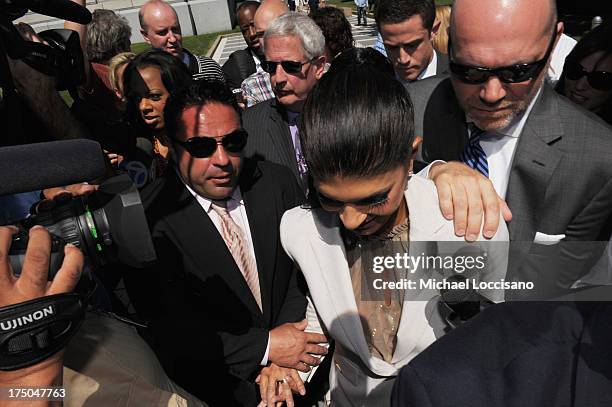 Personalities Joe Giudice and Teresa Giudice appear in court to face charges of defrauding lenders, illegally obtaining mortgages and other loans as...