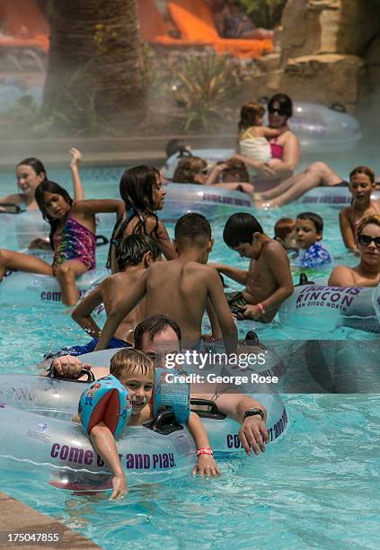 The new Lazy River water theme park at Harrah's Rincon Hotel & Casino is jammed with people on July 23 near Escondido, California. The interior...