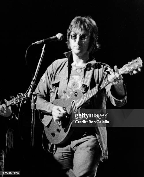 John Lennon performs at Live In New York City Benefit Concert on August 30, 1973 at Madison Square Garden in New York City.