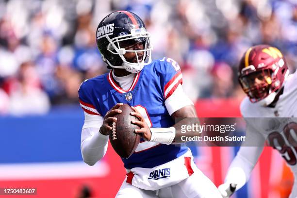 Tyrod Taylor of the New York Giants looks to pass the ball in the first half of the game against the Washington Commanders at MetLife Stadium on...