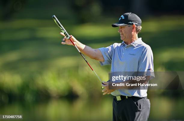 Lee Janzen lines up a putt on the 1st hole during the final round of the Dominion Energy Charity Classic at The Country Club of Virginia on October...