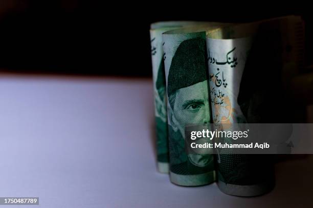 the portrait of mohammad ali jinnah, pakistan's founder, is seen on a pakistani five hundred rupee banknote - monetary policy stock pictures, royalty-free photos & images