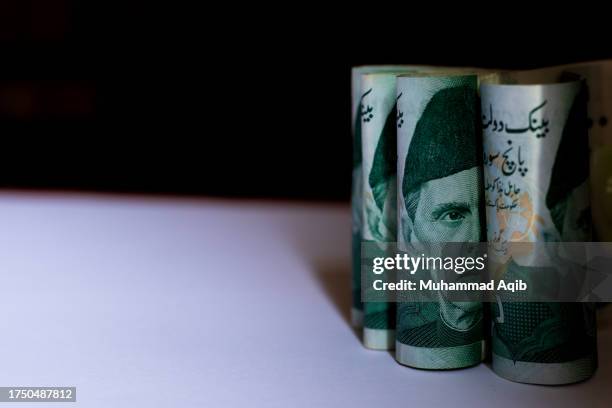 the portrait of mohammad ali jinnah, pakistan's founder, is seen on a pakistani five hundred rupee banknote - monetary policy stock pictures, royalty-free photos & images