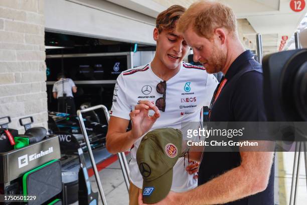 George Russell of Great Britain and Mercedes speaks to Prince Harry, Duke of Sussex in the Mercedes garage prior to the F1 Grand Prix of United...
