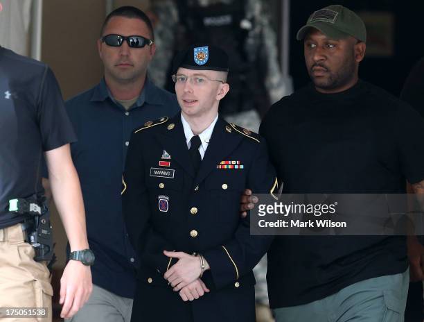 Army Private First Class Bradley Manning is escorted by military police as he leaves his military trial after he was found guilty of 20 out of 21...