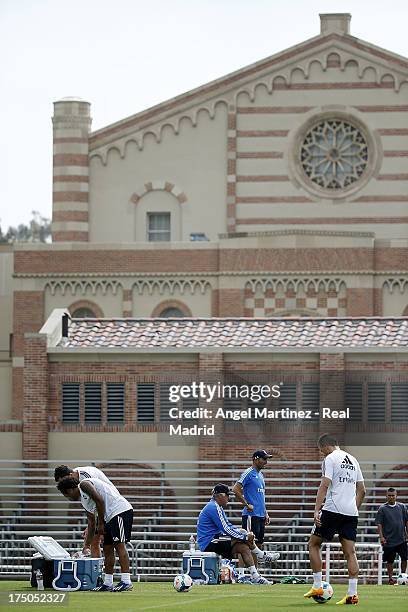 Head coach Carlo Ancelotti and assistant coach Zinedine Zidane of Real Madrid follow their players during a training session at UCLA Campus on July...