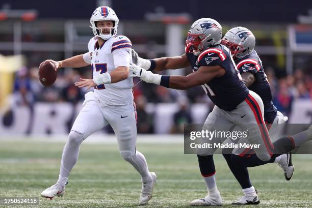 Josh Allen of the Buffalo Bills looks to pass the ball in the first half of the game against the New England Patriots at Gillette Stadium on October...