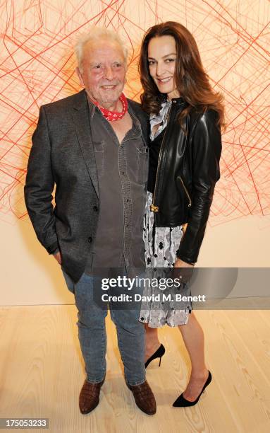 David Bailey and Catherine Bailey attend a private view of 'HUGO: Red Never Follows', celebrating 20 years of Hugo Boss, at the Saatchi Gallery on...