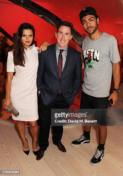 Bip Ling, Rob Brydon and Noah Becker attend a private view of 'HUGO: Red Never Follows', celebrating 20 years of Hugo Boss, at the Saatchi Gallery on...