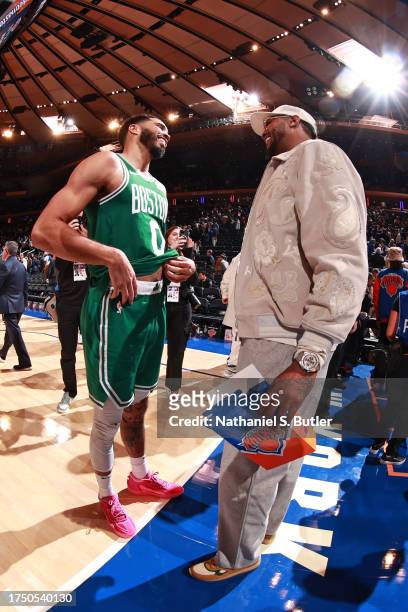 Jayson Tatum of the Boston Celtics greets Carmelo Anthony after the game against the New York Knicks on October 25, 2023 at Madison Square Garden in...