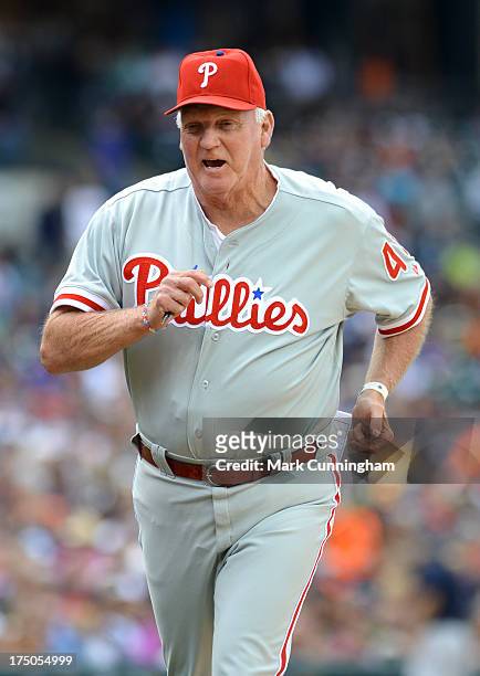 Manager Charlie Manuel of the Philadelphia Phillies looks on from the dugout during the game against the Detroit Tigers at Comerica Park on July 28,...