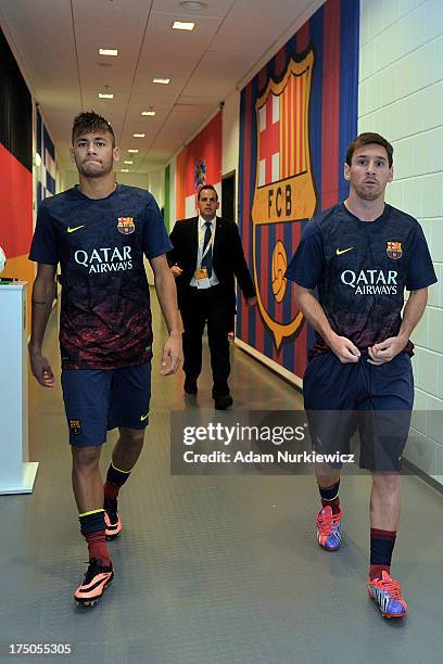 Lionel Messi and Neymar walk down the players tunnel during a Pre Season Friendly match between Lechia Gdansk and FC Barcelona on July 30, 2013 in...